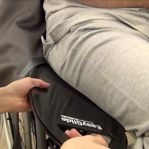 Handicare SystemRoMedic EasyGlide Oval Mini user on wheelchair – Sliding Board | VIVA Mobility