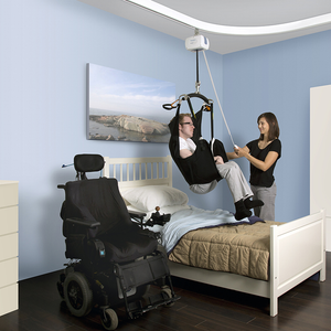 Handicare Prism Medical C-300 Fixed Ceiling Lift in use