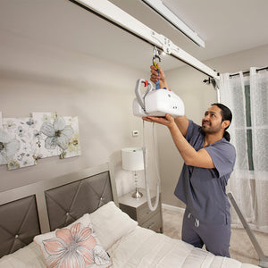 Handicare FST-300 caregiver installing portable ceiling lift – Safe Patient Handling | VIVA Mobility