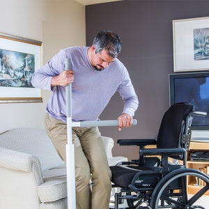 HealthCraft Advantage Rail wheelchair user transferring to chair – Home Safety Solutions | VIVA Mobility