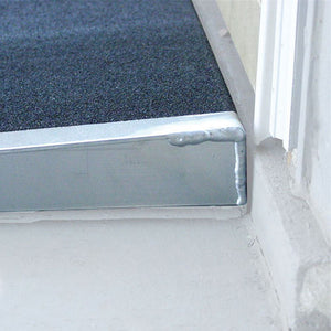 PVI Self-Supporting Solid Surface Threshold Ramp at doorway  | VIVA Mobility